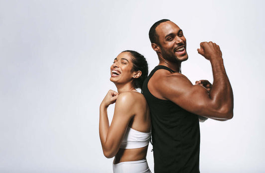 young couple showing off their muscles from working out and taking Whey Protein8