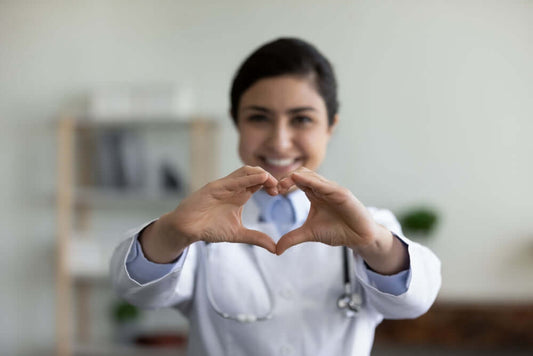 A Medical Provider showing the hand love symbol because she agrees that Turmeric Gummies are great